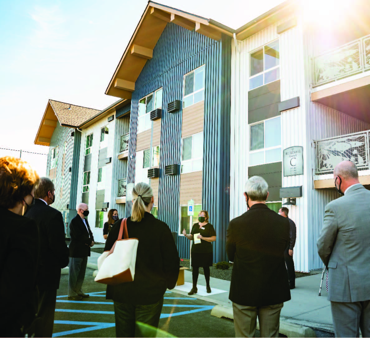 Morning picture outside of the Gonzaga Family haven with a group of people listening intently to a presenter. 