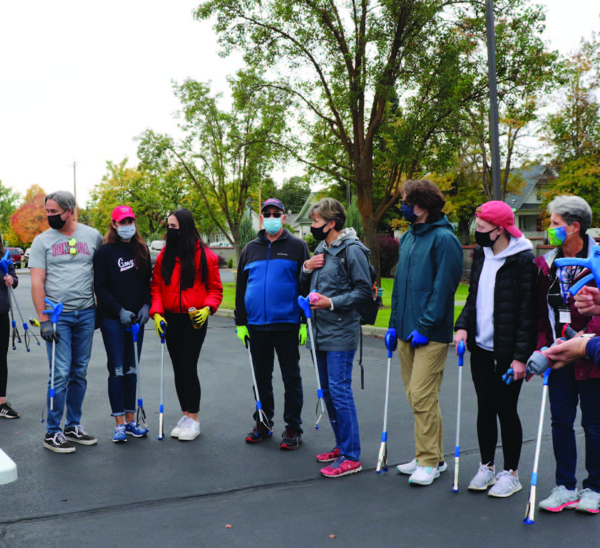 Gonzaga families waiting anxiously for doughnuts and early in the morning before going out to pick up trash. 