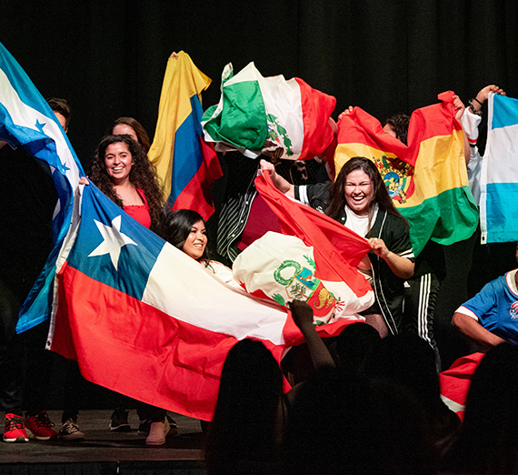 students with flags representing many countries 