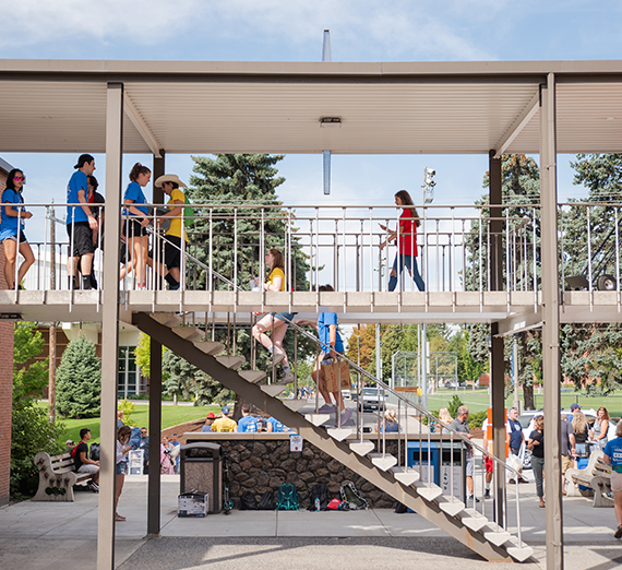 Students and families walk around the stairwells of Catherine Monica residence hall during move-in day.