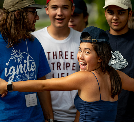 A group of four students goof around during Orientation weekend.