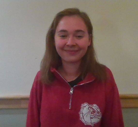 A photo of a current student. She is smiling and wearing a red Gonzaga pullover.