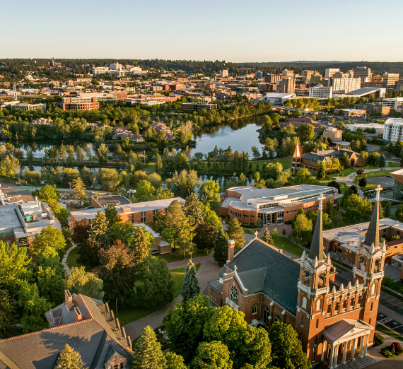 An aerial shot of St. Al's with the Spokane skyline behind it.