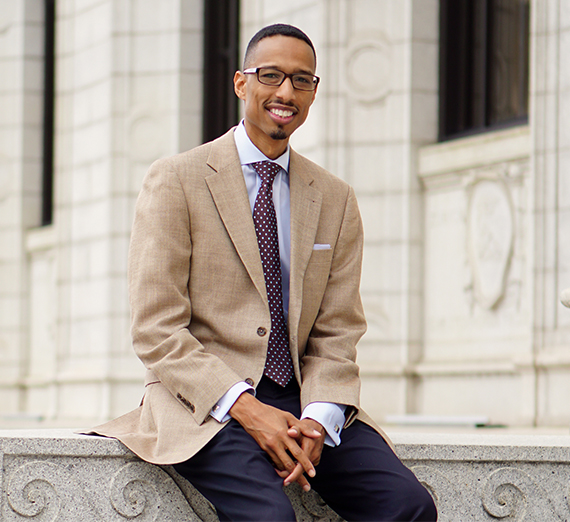 black man in suit on steps