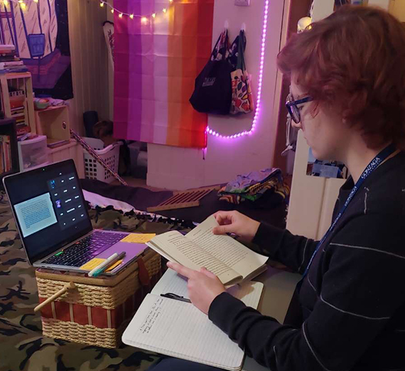 Female in dorm room with computer