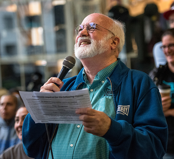 Father Greg Boyle smiles with crowd
