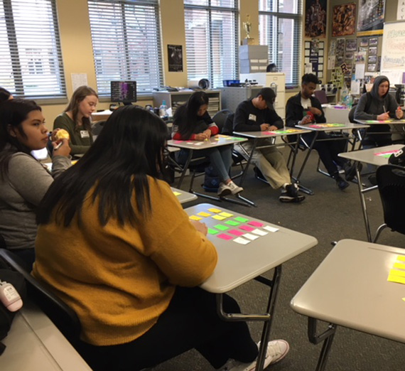 In pre-COVID-19 days, Rogers students meet with GU mentors at a SPARKS program in the high school.