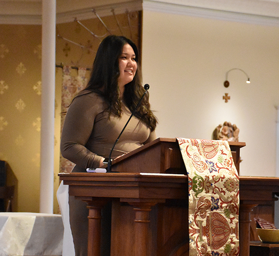 Kelli Kikumoto speaking at the 2024 Center for Community Engagement missioning ceremony. 