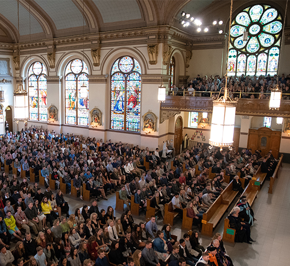 inside St. Aloysius Church, full with people