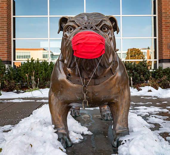 spike sculpture with red mask