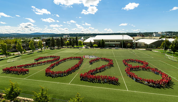 Students spell out 2028 on a field