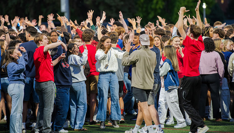 A pack of students cheer at Play Fair