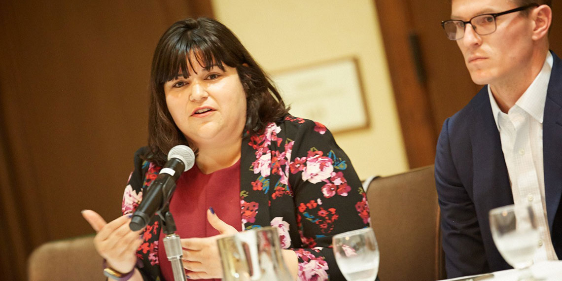 Danielle Cendejas speaks into a microphone