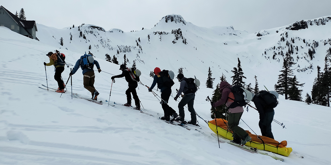 students pull body up a mountain for training