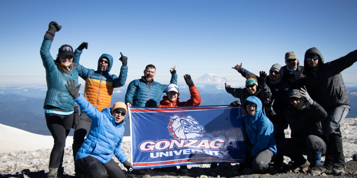 group on the mount adams summit with Gonzaga flag
