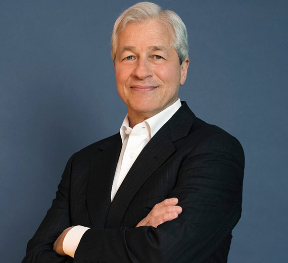 Jamie Dimon looks into the camera with his arms crossed