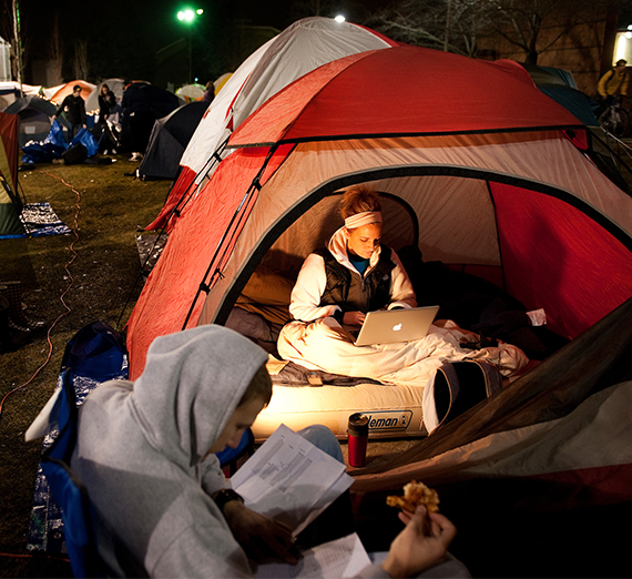 Two Students do homework in Tent City