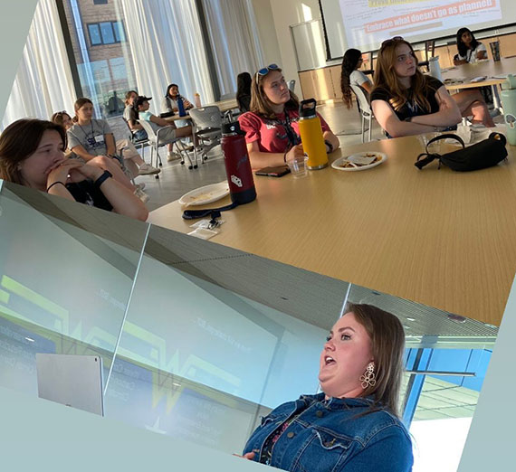 Students listen to mealtime speaker