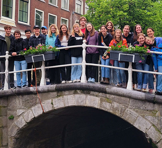 Students on the canal bridge near the market