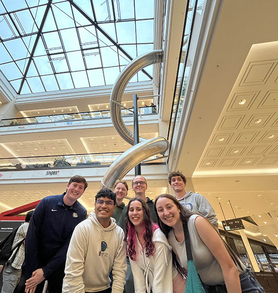 Students at curled slide