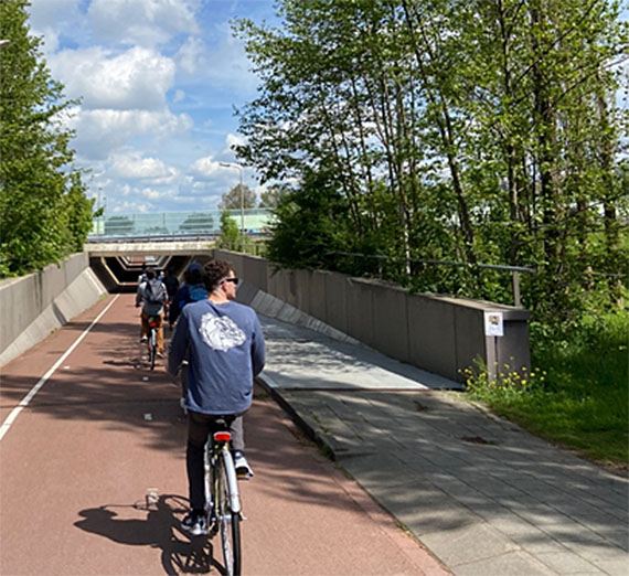 Students head down a bike underpass.