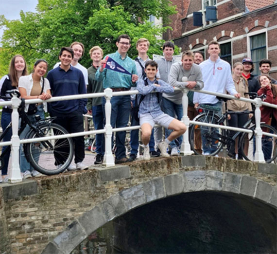 Students on the canal bridge near the market