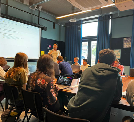 Students on the canal bridge near the market