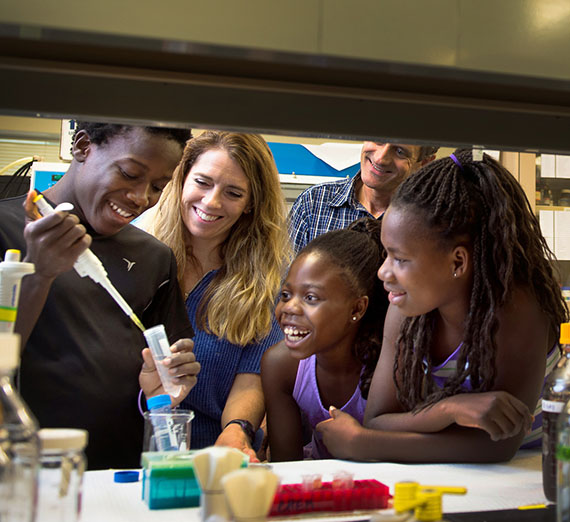 Gonzaga University Interim Engineering Dean Jennifer Shepherd conducts science experiments with young students.