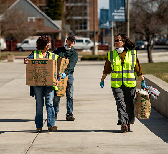 Staff help students move out of their dorms