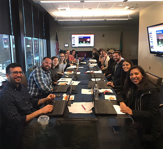 The Admissions team meet in a conference room