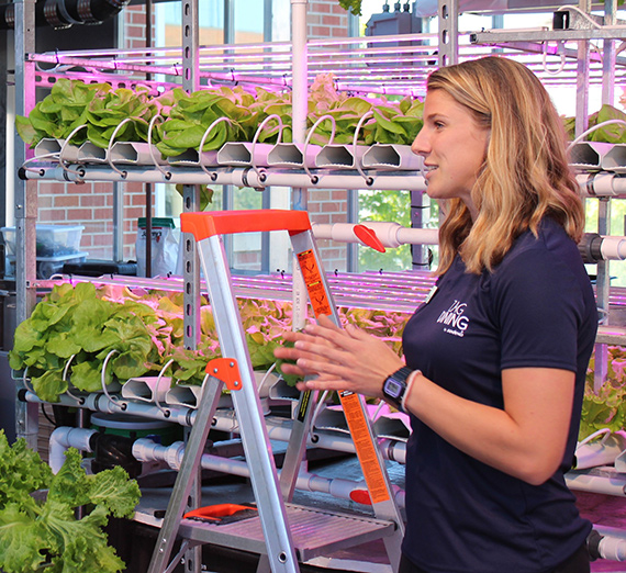 Annie Wissmiller speaks in the greenhouse