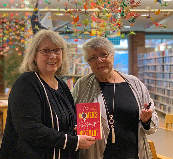 author and librarian with book