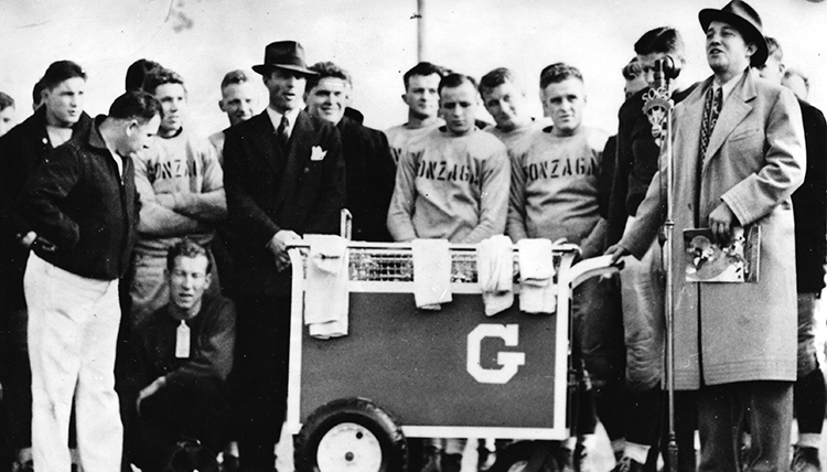 Bing Crosby stands with  football team