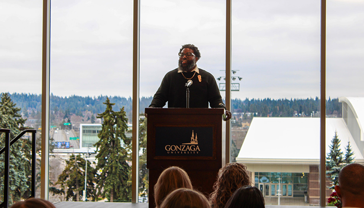 Person speaking to a room full of people.