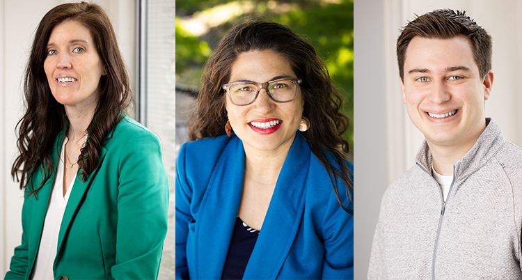 A photo of three people.