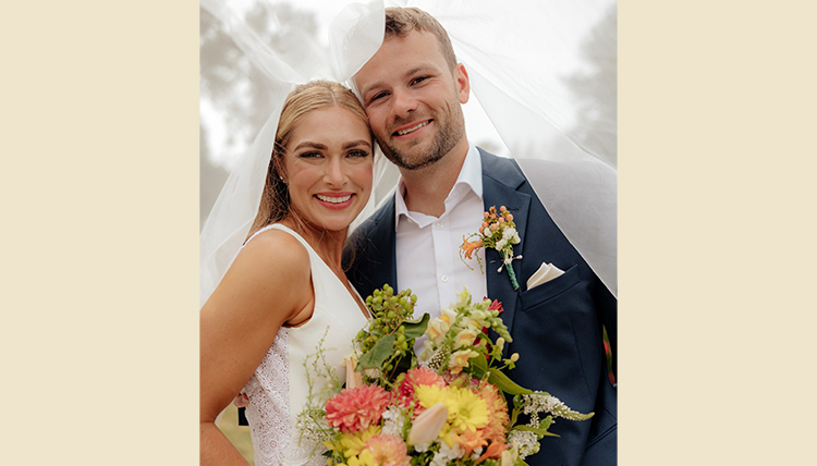 Glynn Baxter and husband at their wedding.