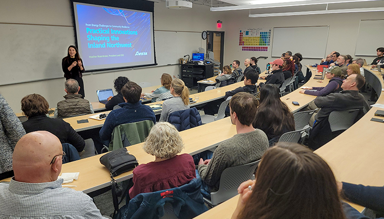 A crowded room at a discussion.