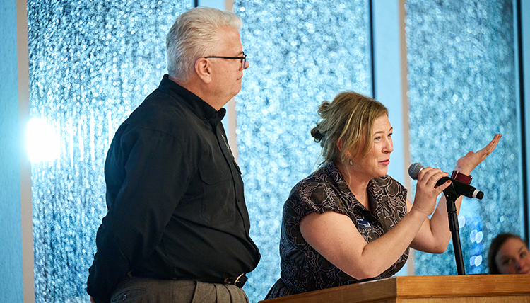 Molly Ayers (right), the assistant dean of the Center for Community Engagement, addressing the crowd at the 30th Anniversary Celebration.