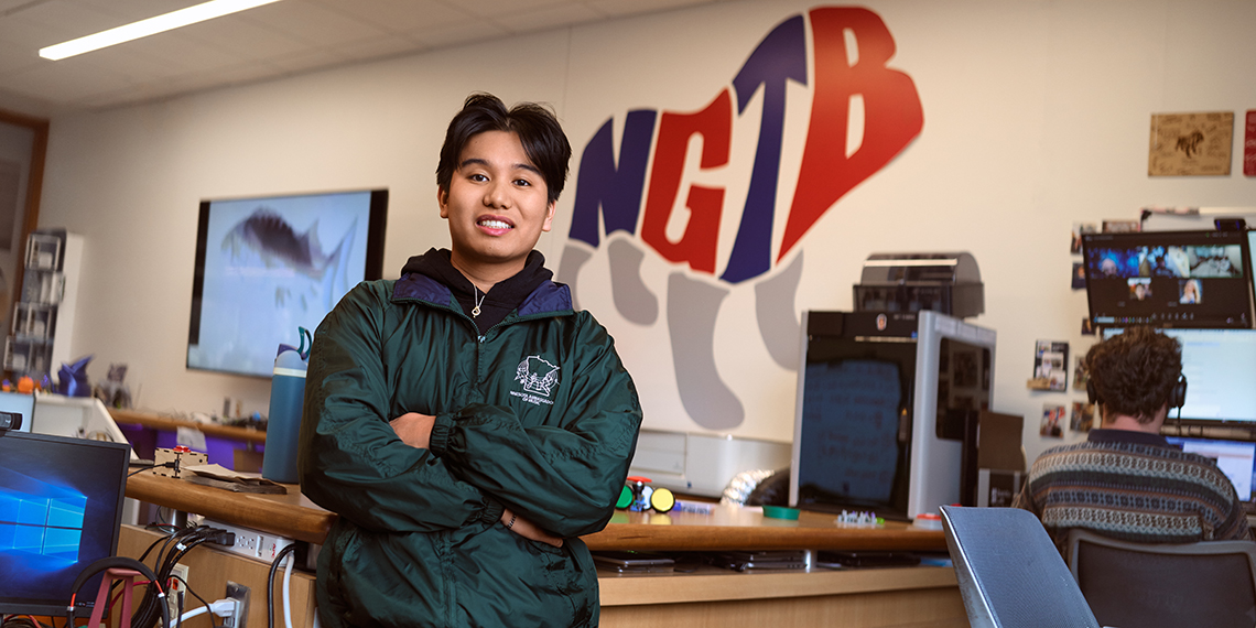 a man stands with his arms crossed