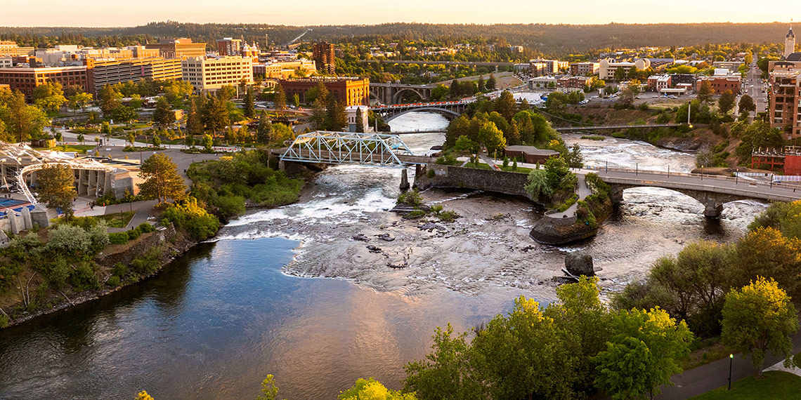 An aerial view of the Spokane River running through downtown Spokane.