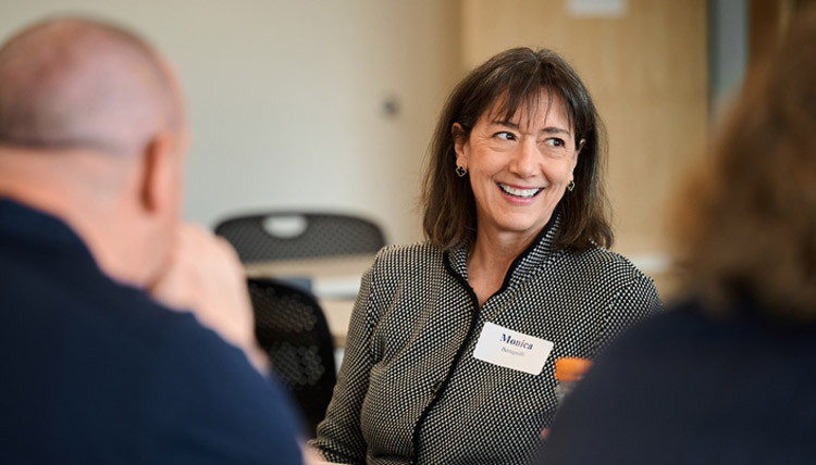 Monica Bertagnolli, former director of the National Institute of Health, speaks to a roundtable of Gonzaga students and faculty.