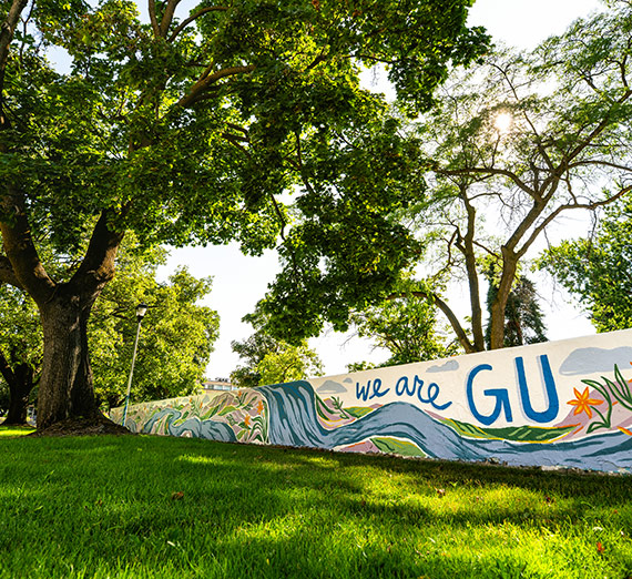 A mural on Gonzaga's Bulldog Board reads "We are GU."