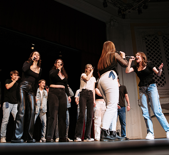 BBT sings on stage at the ICCA 