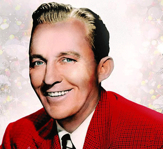 Bing Crosby smiles, wearing a red sweater