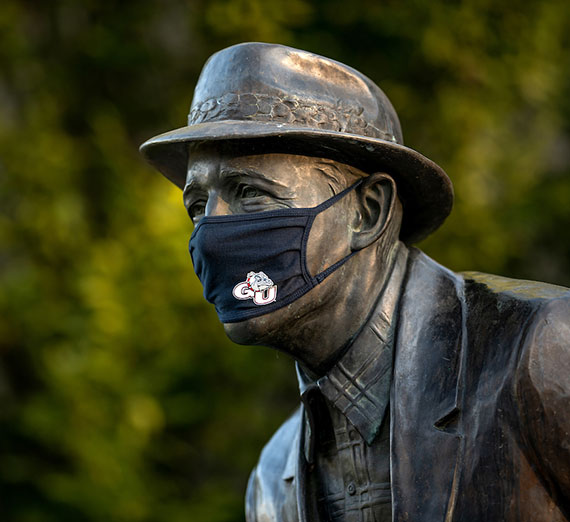 Bing Crosby statue in mask on Gonzaga campus.