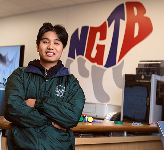 A man stands with his arms crossed