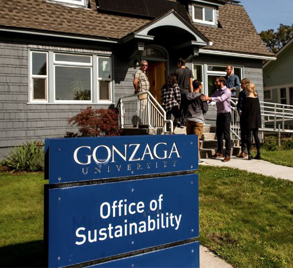 The Office of Sustainability sign outside a blue house. 