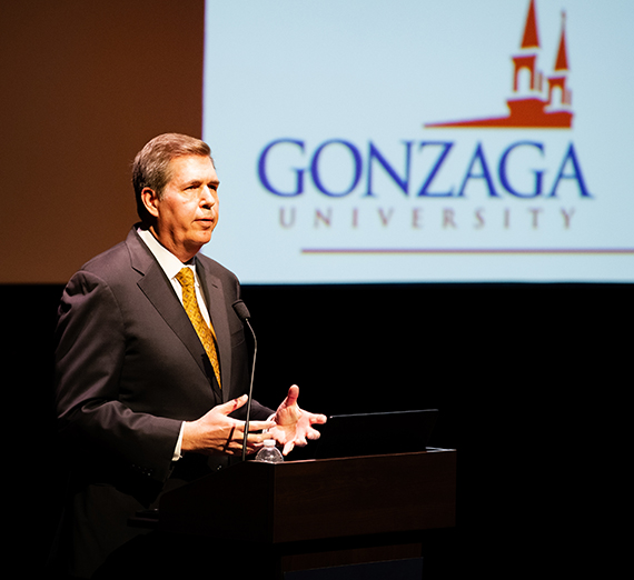 President McCulloh standing at a podium delivering a speech. 