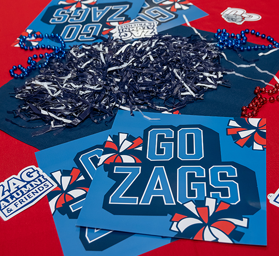 "Go Zags" cheering cards on a table.