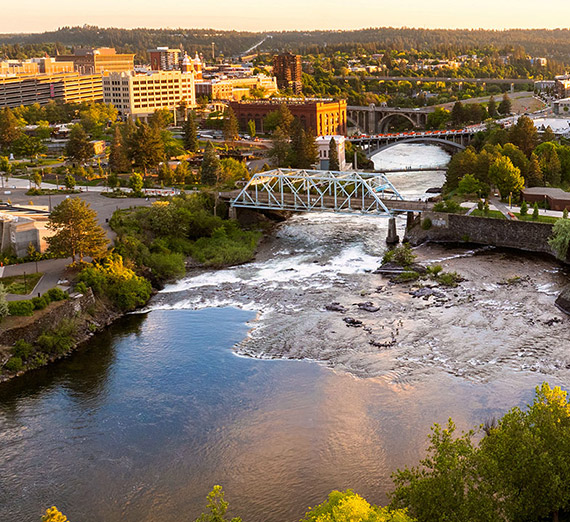 An aerial view of the Spokane River running through downtown Spokane.